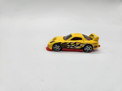 24/Seven 1/64 die-cast loose Hot Wheels yellow  racer with black flames.