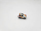Small Micro Machine Chevy Blazer Silver with Yellow & Red Trim Chome.