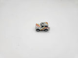 Small Micro Machine Chevy Blazer Silver with Yellow & Red Trim Chome.