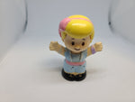 Fisher Price Little People Girl with pink bow.